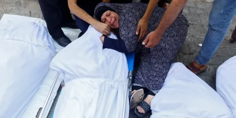 A woman mourns a loved one killed by the Israeli bombardment of Gaza, at a hospital in Gaza City, on October 11, 2023 [Reuters/Mohammed Salem]