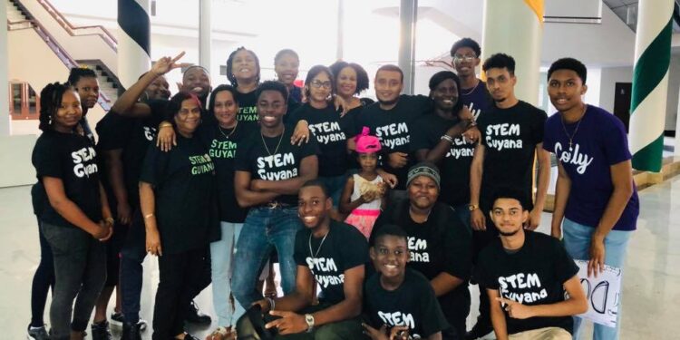 Karen Abrams (back row fifth from left) with STEMGuyana children and staff (STEMGuyana Facebook photo)