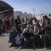 File: Palestinians wait to cross into Egypt at the Rafah border crossing in the Gaza strip, on Monday Oct. 16, 2023. As desperate Palestinians in sealed off Gaza try to find refuge under Israel's relentless bombardment in retaliation for Human's brutal Oct. 7 attack, neighboring Egypt and Jordan have replied with staunch refusal, and they have multiple reason for rejecting the idea. (AP Photo/Fatima Shbair, File)