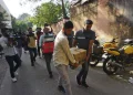 Secretary Officers carry boxes of materials confiscated after a raid at the offce in NewsClick in New Delhi India October 3, 2023