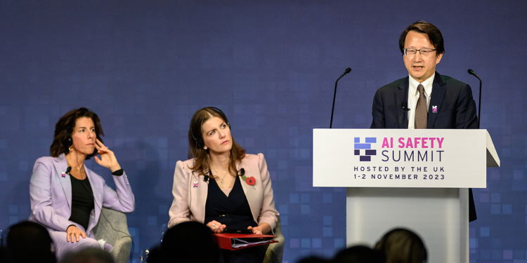 China's vice minister of science and technology Wu Zhaohui (R), speaks at the AI Safety Summit at Bletchley Park, and U.S. Secretary of Commerce Gina Raimondo (L) and British Secretary of State for Science Innovation and Technology Michelle Donelan (C) listen to Wu's speech in Bletchley, Britain, November 1, 2023. /CFP