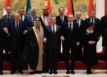 China's Foreign Minister Wang Yi with representatives from Muslim-majority nations at the Diaoyutai State Guest House in Beijing on November 20.