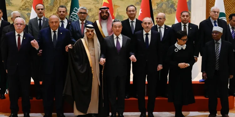 China's Foreign Minister Wang Yi with representatives from Muslim-majority nations at the Diaoyutai State Guest House in Beijing on November 20.