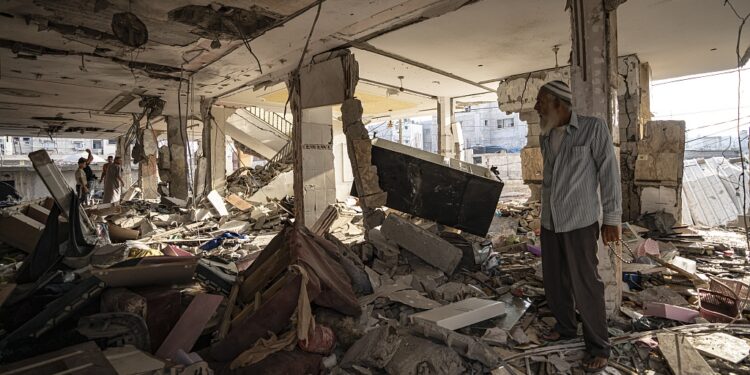 Palestinians look at the destruction after Israeli strikes on the Gaza Strip in Khan Younis, Friday, Now. 3, 2023. (AP Photo/Fatima Shbair)