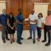 Mr. Kevon David Jr, Vice-President of the Guyana Rugby Football Union receiving cheque from President of the Guyana Olympic Association, Mr. Godfrey Munroe.
Looking on from left to right: G.O.A.'s Vice-President Philip Fernandes, Secretary-General Vidushi Persaud-McKinnon ,Asst. Secretary Emelia Ramdhani and Treasurer Garfield Wiltshire.