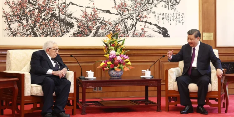 China's leader Xi Jinping (R) speaks with former US secretary of state Henry Kissinger during a meeting in Beijing on July 20, 2023.