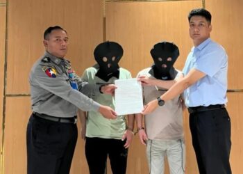 Two suspects of telecom fraud are handed over by Myanmar to the Chinese police at Yangon International Airport and escorted back to China on August 23, 2023. Photo: Chinese Embassy in Myanmar