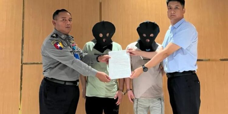 Two suspects of telecom fraud are handed over by Myanmar to the Chinese police at Yangon International Airport and escorted back to China on August 23, 2023. Photo: Chinese Embassy in Myanmar