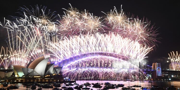 Fireworks explode over the Sydney Opera House and on the Harbour Bridge as part of New Year's Eve celebrations in Sydney, Monday, Jan. 1, 2024. (Dan Himbrechts/AAP Image via AP)