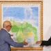 National Assembly President Jorge Rodriguez, left, and Chairman of the Special Commission for the Defense of Guyana Essequibo Hermann Escarra, shake hands after unveiling Venezuela's new map that includes the Essequibo territory, a swath of land that is administered and controlled by Guyana but claimed by Venezuela, in Caracas, Venezuela, Friday, Dec. 8, 2023. (AP Photo/Matias Delacroix)