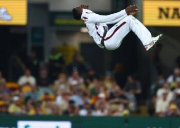 Kevin Sinclair celebrated with a backflip after taking his first career Test wicket against Australia in Brisbane