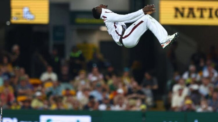 Kevin Sinclair celebrated with a backflip after taking his first career Test wicket against Australia in Brisbane