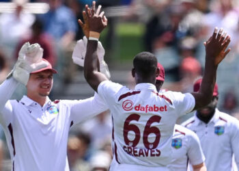 Following an ICC rule change, West Indies' cricketers wore the logo of a Philippines gambling brand in the first Test against Australia. Photograph: Izhar Khan/AFP/Getty Images