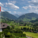A Swiss flag and the Alps surrounding the resort of Gstaad in Saanen municipality, July 23, 2023. /CFP