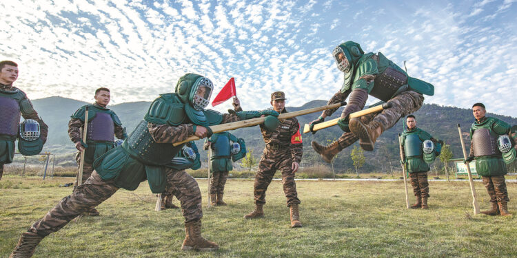 People's Armed Police Force soldiers engage in combat training in Hezhou, Guangxi Zhuang autonomous region, on Tuesday, as the Chinese military opened its annual training sessions. ZHANG BIHAI/FOR CHINA DAILY