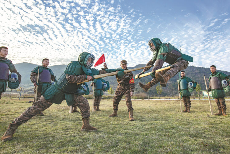 People's Armed Police Force soldiers engage in combat training in Hezhou, Guangxi Zhuang autonomous region, on Tuesday, as the Chinese military opened its annual training sessions. ZHANG BIHAI/FOR CHINA DAILY