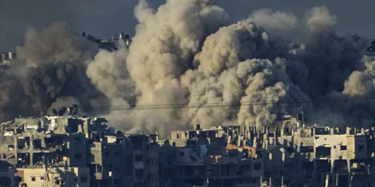 FILE - Smoke rises following an Israeli bombardment in the Gaza Strip, as seen from southern Israel, Saturday, Dec. 16, 2023. Israel is sending top legal minds, including a Holocaust survivor, to The Hague this week to counter allegations that it is committing genocide against Palestinians in Gaza. (AP Photo/Ariel Schalit, File)
