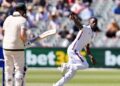 Shamar Joseph celebrates the wicket of Steve Smith with his first ball in Test cricket.