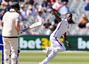 Shamar Joseph celebrates the wicket of Steve Smith with his first ball in Test cricket.