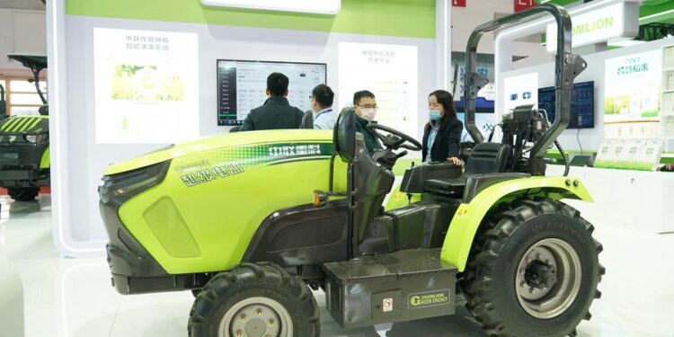 An electric tractor used in greenhouse is pictured in the exhibition area on green agriculture chain during the China International Supply Chain Expo (CISCE) in Beijing, capital of China, Nov. 30, 2023. (Xinhua/Ren Chao)