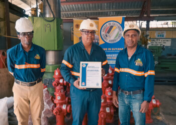 (L-R) BACIF Quality Control Manager Mr. Adrian Barkoye, Managing Director Mr. Peter Pompey and Operations Manager Mr. Rondel Ali poses with the GNBS Certificate on Feb. 8