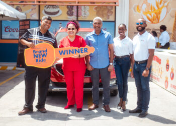In picture (L-R) Mr Robert Singh, General Manager of Massy Stores; Dr Yara Martinez Diaz (winner in red); Mr Navin Thakur, CEO and Snr Vice President of Massy Distribution; Chrystel Taylor, Marketing Supervisor of Massy Stores; and Christpen Bobb-Semple, Assistant Vice President of Massy Stores Guyana during the handing over of the keys for the new MG ZS compact SUV that Diaz won from Massy Stores’ 2023/4 Christmas Jackpot Promotion.