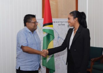 Finance Minister Dr. Ashni Singh and Reigning Miss World Guyana Andrea King