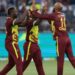 Andre Russell (left), Roston Chase (right) and Sherfane Rutherford celebrate a wicket.