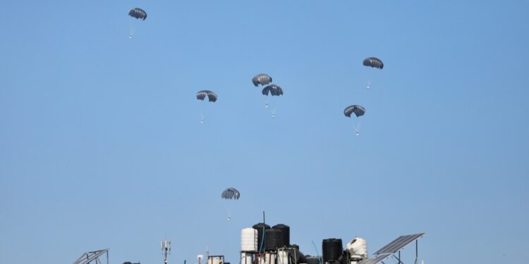 Humanitarian aid is airdropped over the northern Gaza Strip, on March 5, 2024. (Photo by Mohammed Ali/Xinhua)