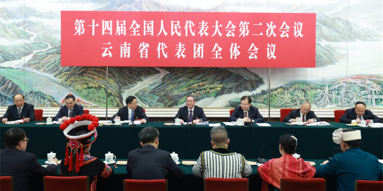 Li Qiang, a member of the Standing Committee of the Political Bureau of the Communist Party of China Central Committee and premier of the State Council, joins his fellow deputies from the delegation of Yunnan Province to deliberate on the government work report at the second session of the 14th National People's Congress (NPC) in Beijing, capital of China, March 5, 2024. [Photo/Xinhua]