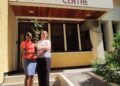 Keisha Harrison, Project Officer at RISE Life Management Services, presents a true Jamaican Mahogany plant to Dr. Sylvia Mitchell of the UWI Biotechnological Centre. Dr. Mitchell also received the DNA analysis research findings.