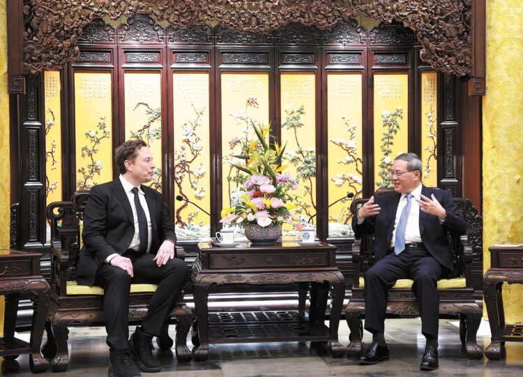 Premier Li Qiang meets on Sunday with Elon Musk, founder and CEO of US electric car manufacturer Tesla, at Diaoyutai Guest House in Beijing. [FENG YONGBIN / CHINA DAILY]