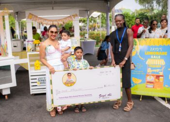 First Lady Arya Ali and her two sons Zayd and Ilan hand over a cheque for $1M to the representative of Fureva Hope Alive Animal Rescue Sanctuary after yesterday’s lemonade sale