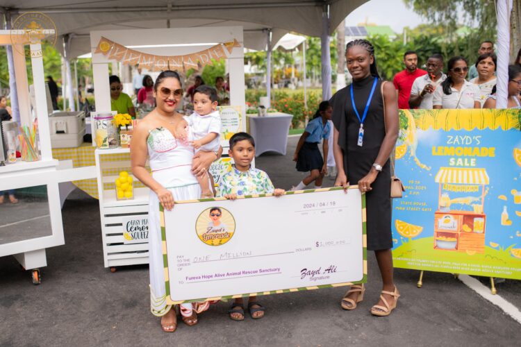 First Lady Arya Ali and her two sons Zayd and Ilan hand over a cheque for $1M to the representative of Fureva Hope Alive Animal Rescue Sanctuary after yesterday’s lemonade sale