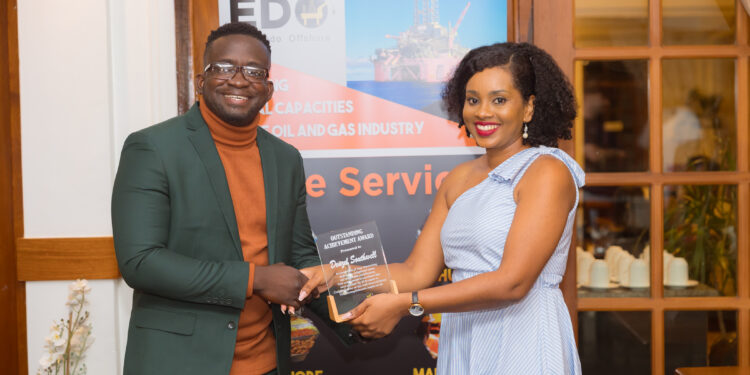 Denzel Southwell received award from Ms Thalia Wilson of EDO