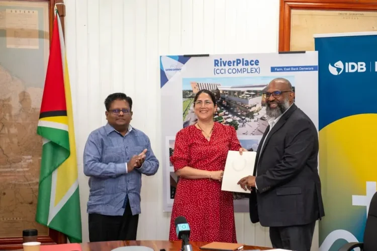 Caption (Left to right): Honorable Dr. Ashni Singh-Senior Minister within the Office of the President with Responsibility for Finance and Public Service; IDB Representative Lorena Solorzano Salazar; Mr. Errol LeBlanc, Vice President of Unicomer Caribbean.