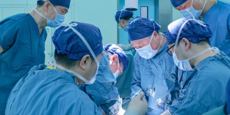 A team led by Qin Weijun, a doctor at Xijing Hospital of the Air Force Medical University, performs a surgery to transplant a genetically modified pig kidney into a brain-dead recipient at the hospital in Xi'an, northwest China's Shaanxi Province, March 25, 2024. /Xijing Hospital of the Air Force Medical University via Xinhua
