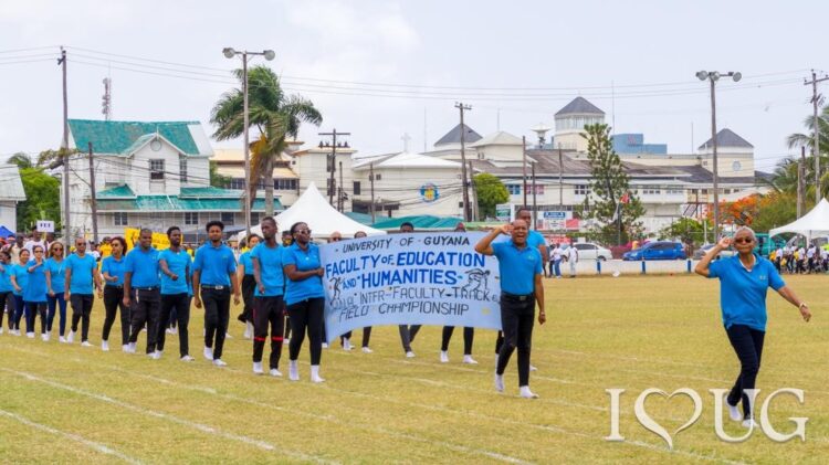 Dr Roslyn Khan, Dean of the Faculty of Education and Humanities (FSS) leads the FSS contingent at the March Past. The FEH emerged as the overall winner of UG’s Athletics Championships.