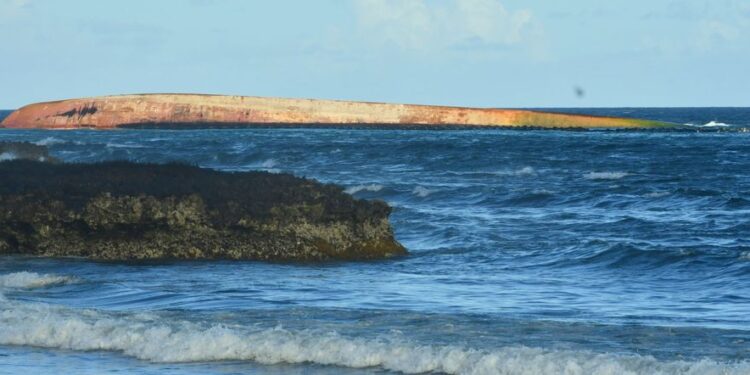 The overturned Gulfstream barge involved in the recent oil spill off the coast of Tobago. VINDRA GOPAUL-BOODAN