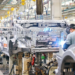 Workers assemble new energy vehicles on an automated production line in Ganzhou City, east China's Jiangxi Province, May 6, 2023. /CFP