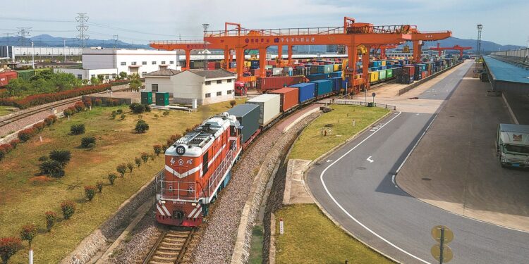 A freight train carrying 110 containers of household appliances and mechanical equipment departs from Jinhua, Zhejiang province, on its way to Budapest, Hungary, on April 1. HU XIAOFEI/FOR CHINA DAILY