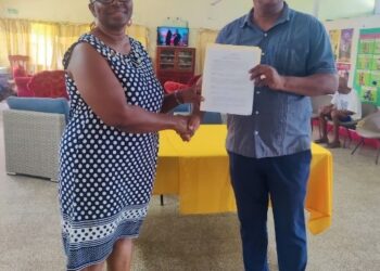 From Left_ Yolanda James, President, Eddie's Home and President of the Roteract Club Peter Pompey
