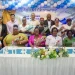 Senior health officials pose with the nurses who were awarded for 30 or more years of service