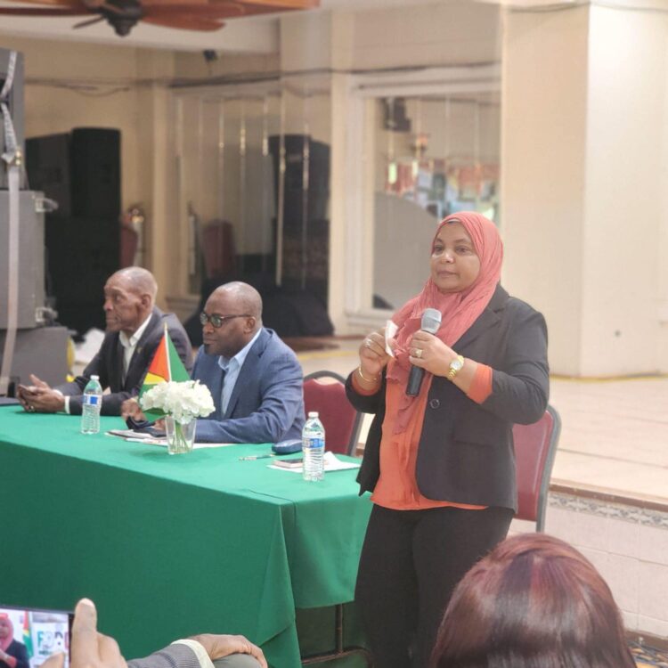 Natasha Singh-Lewis (standing) addressing the Brooklyn town hall meeting May 10, 2024
