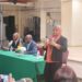 Natasha Singh-Lewis (standing) addressing the Brooklyn town hall meeting May 10, 2024