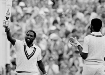 Viv Richards celebrates his century at Old Trafford with Michael Holding(Getty Images)