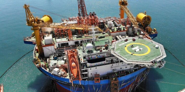An aerial drone photo taken on April 26, 2024 shows Haikui No. 1, Asia's first cylindrical floating, production, storage, and offloading (FPSO) facility, in Qingdao, east China's Shandong Province. (Xinhua/Li Ziheng)