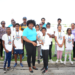 Zaleel Thomas of River Doree Anglican Combined School receives trophy from Florence Demacque, RBEC Vieux Fort- Branch Manager, also in the photo, Director of Sports Clivus Jules, Principal Secretary of the SLNCA Jacqueline Inglis and coaches from Zone 5