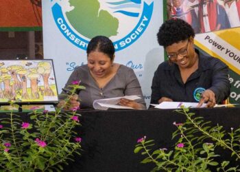 University of Guyana’s Vice-Chancellor, Professor Paloma Mohamed Martin (left) and Vice-Chairperson of the Guyana Marine Conservation Society (GMCS) Board of Directors, Dr. Arianne Harris signing the Memorandum of Understanding at UG’s Education Lecture Theatre.