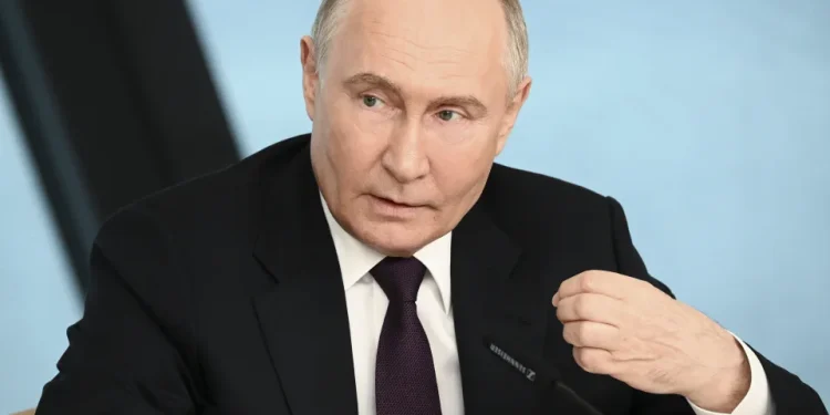 Russian President Vladimir Putin gestures during a call with military leaders on the Ukraine battlefield situation at the Kremlin in Moscow, on Thursday, Dec. 11, 2025. (Gavriil Grigorov, Sputnik, Kremlin Pool Photo via AP)